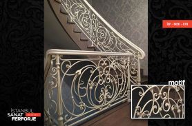 Wrought Iron Stair Railing With White Flower Pattern