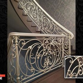 Wrought Iron Stair Railing With White Flower Pattern